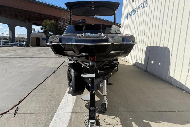 Slide: The Image of 2021 Malibu Wakesetter 23 MXZ boat on trailer near sales office. - 2