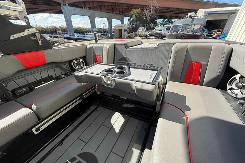 Slide: The Image of Interior of 2021 Malibu Wakesetter 23 MXZ boat with gray and red seating. - 26