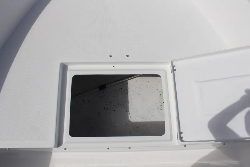 Slide: The Image of Open storage compartment on 2024 Clearwater 1900 CC boat deck. - 23