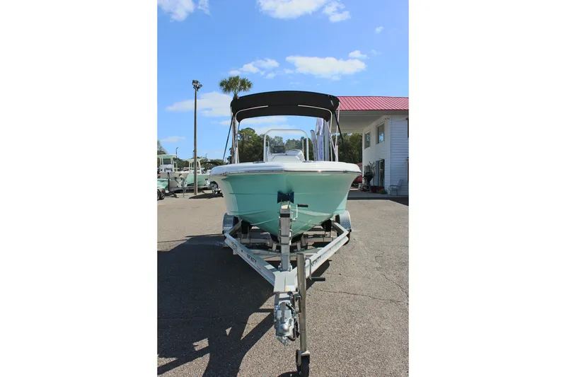 Slide: The Image of 2024 Clearwater 1900 CC boat on trailer under clear blue sky. - 3