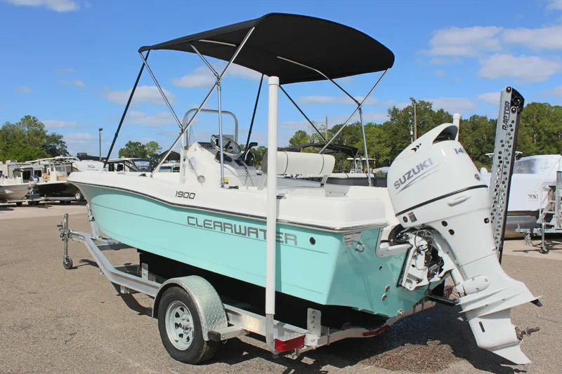 Slide: The Image of 2024 Clearwater 1900 CC boat with Suzuki outboard motor on trailer. - 9