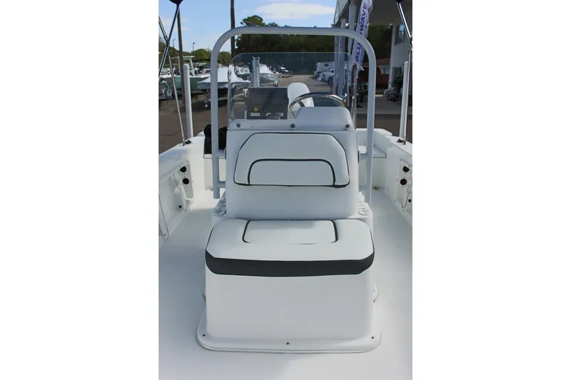 Slide: The Image of 2024 Clearwater 1900 CC boat interior with white seating and console. - 20