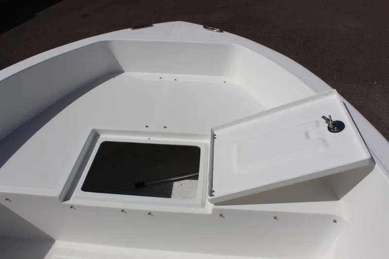 Slide: The Image of 2024 Clearwater 1900 CC boat with open storage compartment on deck. - 24