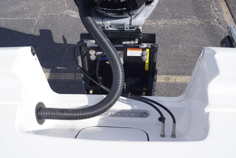 Slide: The Image of Tidewater 2410 Bay Max 2026 boat engine compartment with cables and warning label. - 22
