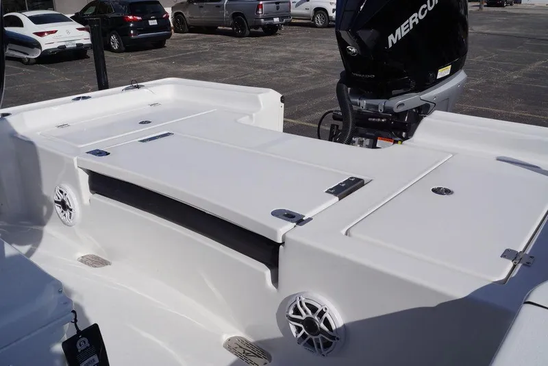Slide: The Image of 2026 Tidewater 2410 Bay Max boat with Mercury engine, featuring spacious deck and storage compartments. - 25