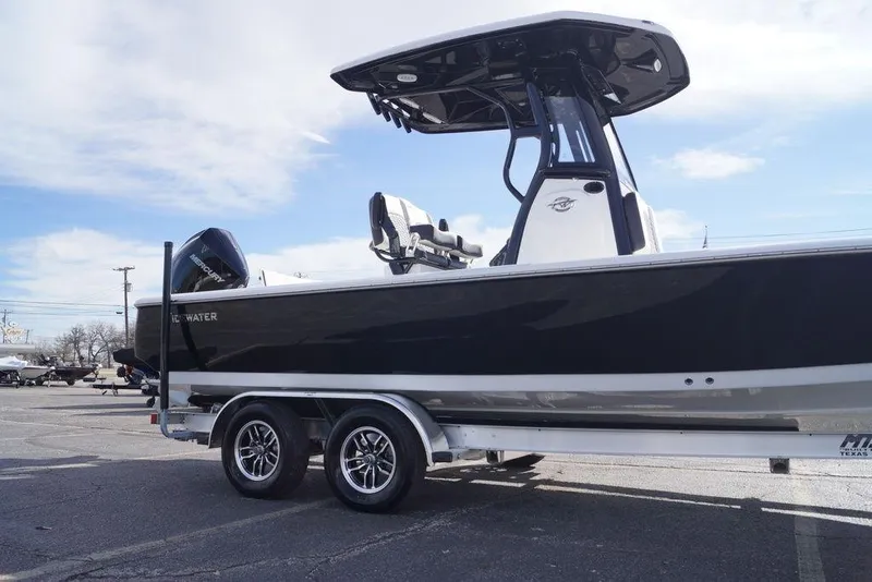 Slide: The Image of 2026 Tidewater 2410 Bay Max boat on trailer under clear sky. - 6