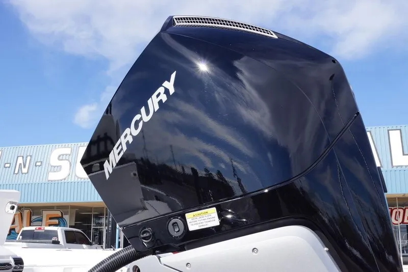 Slide: The Image of Mercury outboard engine on 2026 Tidewater 2410 Bay Max boat, dealership background. - 7