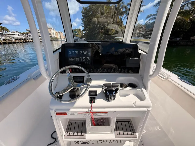 Slide: The Image of Helm console of a 2020 Sea Hunt Ultra 265 SE boat. - 11
