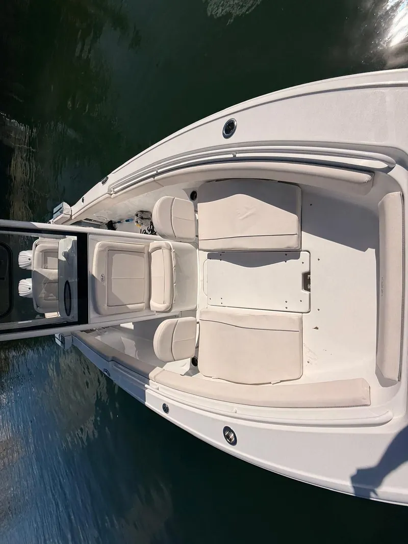 Slide: The Image of 2020 Sea Hunt Ultra 265 SE boat with white deck. - 15