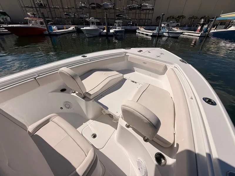 Slide: The Image of Interior view of Sea Hunt Ultra 265 SE boat in harbor. - 16