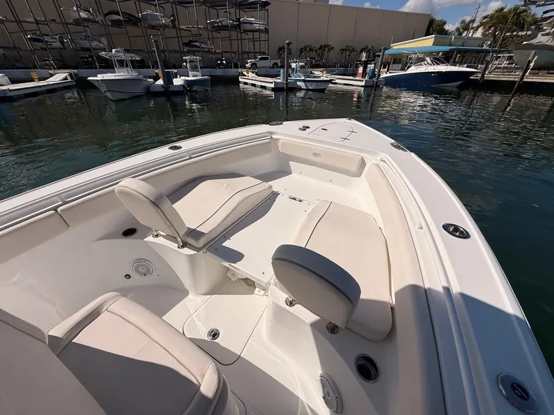 Slide: The Image of Interior view of a 2020 Sea Hunt Ultra 265 SE boat in harbor. - 19
