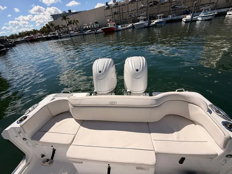 Slide: The Image of Sea Hunt Ultra 265 SE 2020 with twin outboard engines at the marina. - 22