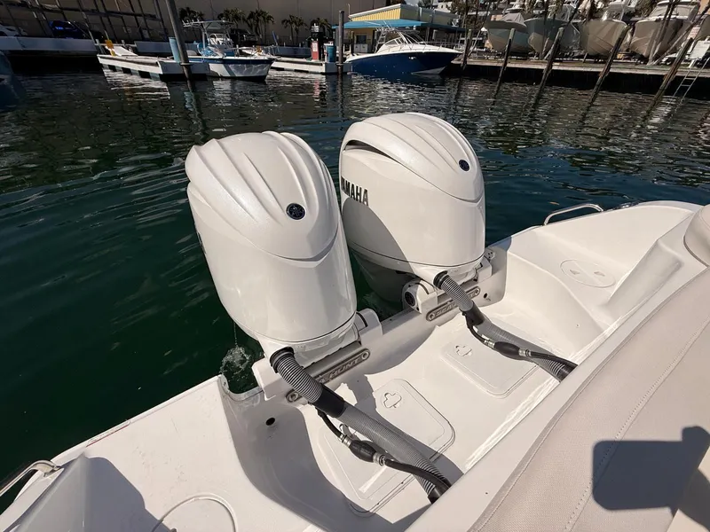 Slide: The Image of Two Yamaha engines on a 2020 Sea Hunt Ultra 265 SE boat. - 23