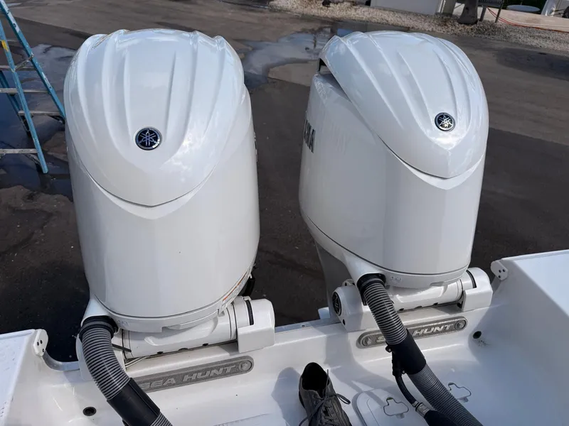 Slide: The Image of Two Yamaha outboard motors on a Sea Hunt Ultra 265 SE boat. - 26