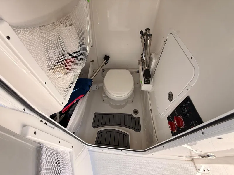 Slide: The Image of Interior of 2020 Sea Hunt Ultra 265 SE with toilet. - 31