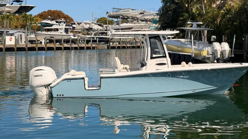 Slide: The Image of 2020 Sea Hunt Ultra 265 SE boat in harbor with Yamaha engine. - 8