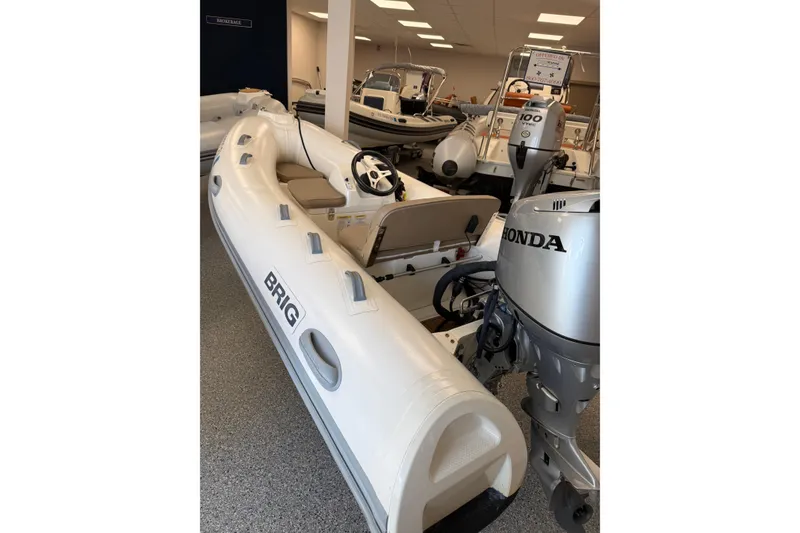 Slide: The Image of 2021 Brig Falcon 360 inflatable boat with Honda outboard motor in showroom. - 3