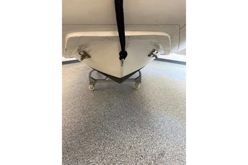Slide: The Image of 2021 Brig Falcon 360 boat hull on wheeled stand, indoor setting. - 8