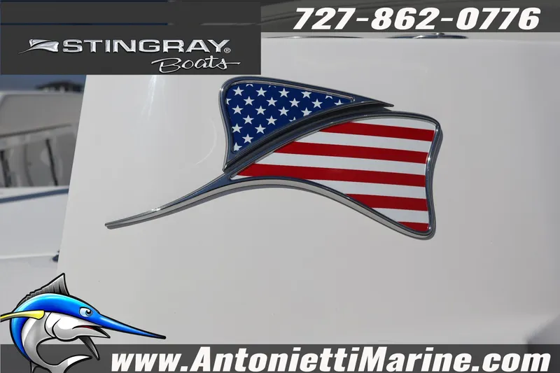 Slide: The Image of Stingray 216 CC 2026 boat with American flag design, Antonietti Marine logo. - 11