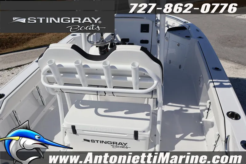 Slide: The Image of 2026 Stingray 216 CC boat interior with seating and rod holders, featuring Antonietti Marine branding. - 12