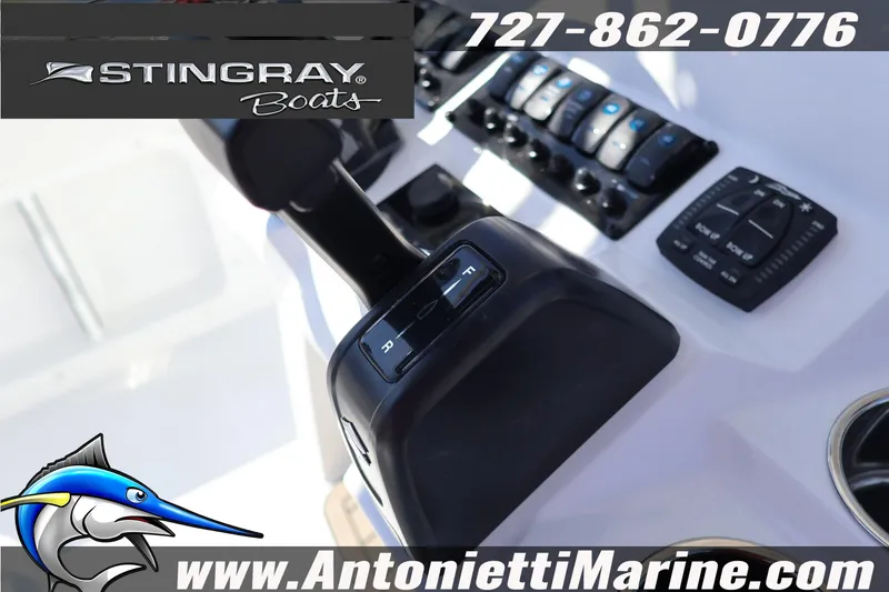 Slide: The Image of Control panel of 2026 Stingray 216 CC boat with throttle and switches, Antonietti Marine branding. - 16