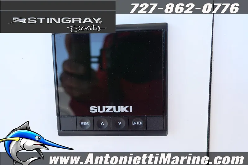 Slide: The Image of 2026 Stingray 216 CC boat featuring Suzuki control panel, Antonietti Marine branding. - 17