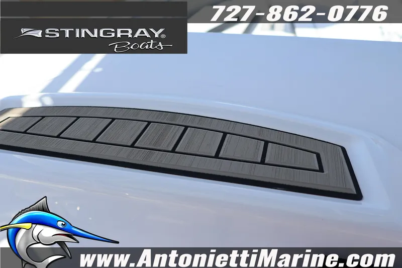 Slide: The Image of 2026 Stingray 216 CC boat detail with logo and contact information. - 18