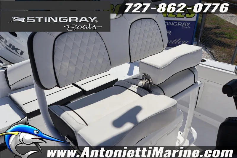 Slide: The Image of 2026 Stingray 216 CC boat seating with logo and contact details. - 20