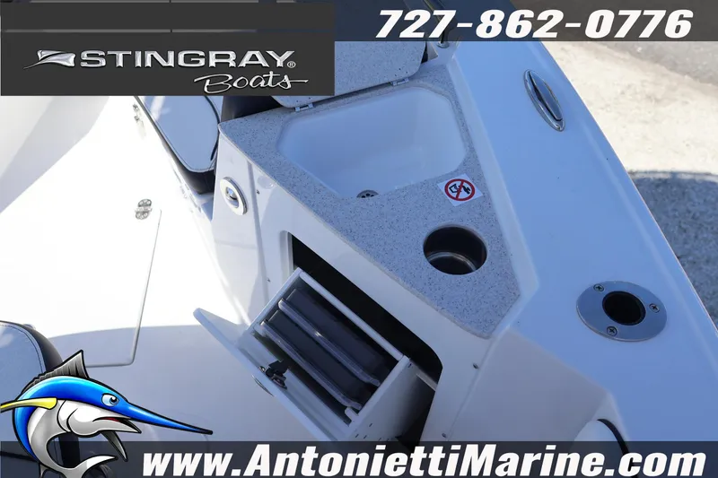 Slide: The Image of 2026 Stingray 216 CC boat interior with storage and sink, Antonietti Marine branding. - 26