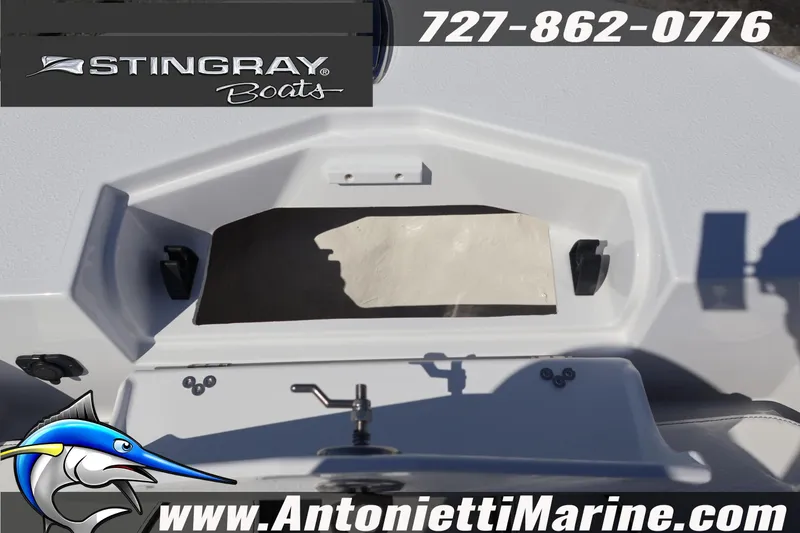 Slide: The Image of 2026 Stingray 216 CC boat interior with storage compartment, Antonietti Marine branding. - 31