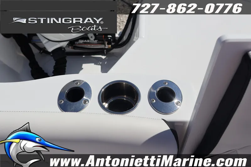 Slide: The Image of 2026 Stingray 216 CC boat interior with cup holders, featuring Antonietti Marine branding. - 39