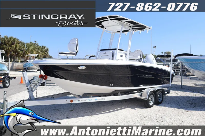 Slide: The Image of 2026 Stingray 216 CC boat on trailer at Antonietti Marine dealership. - 4