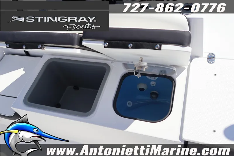 Slide: The Image of 2026 Stingray 216 CC boat interior with storage compartments and seating. - 42