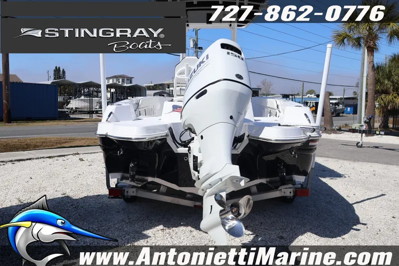 Slide: The Image of 2026 Stingray 216 CC boat with Suzuki engine on trailer at Antonietti Marine. - 6