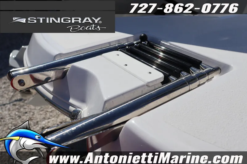 Slide: The Image of 2026 Stingray 216 CC boat ladder detail with contact information and logo. - 8