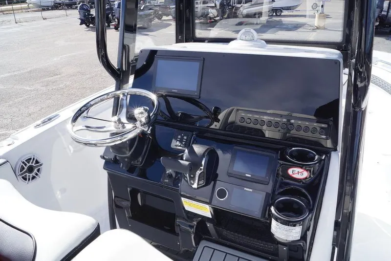 Slide: The Image of Dashboard of 2026 Tidewater 220 LXF boat with modern electronics. - 18