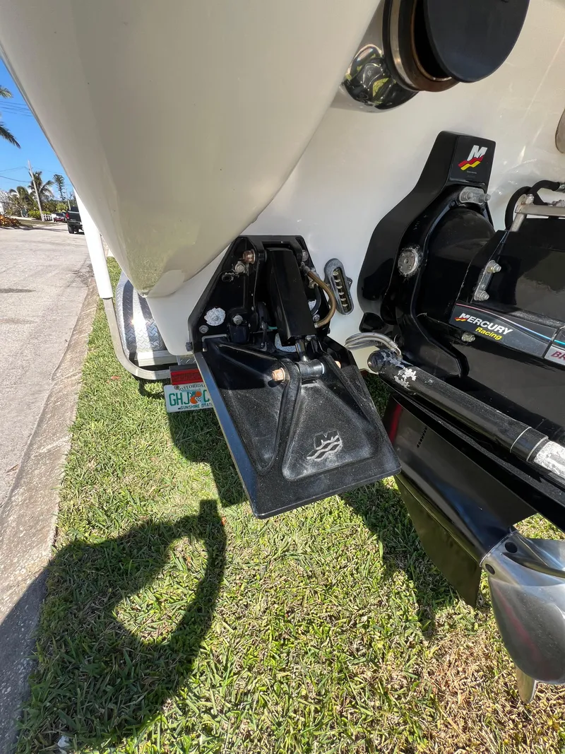 Slide: The Image of 2016 Formula 353 FASTech boat, rear view showing engine components and trim tab. - 13