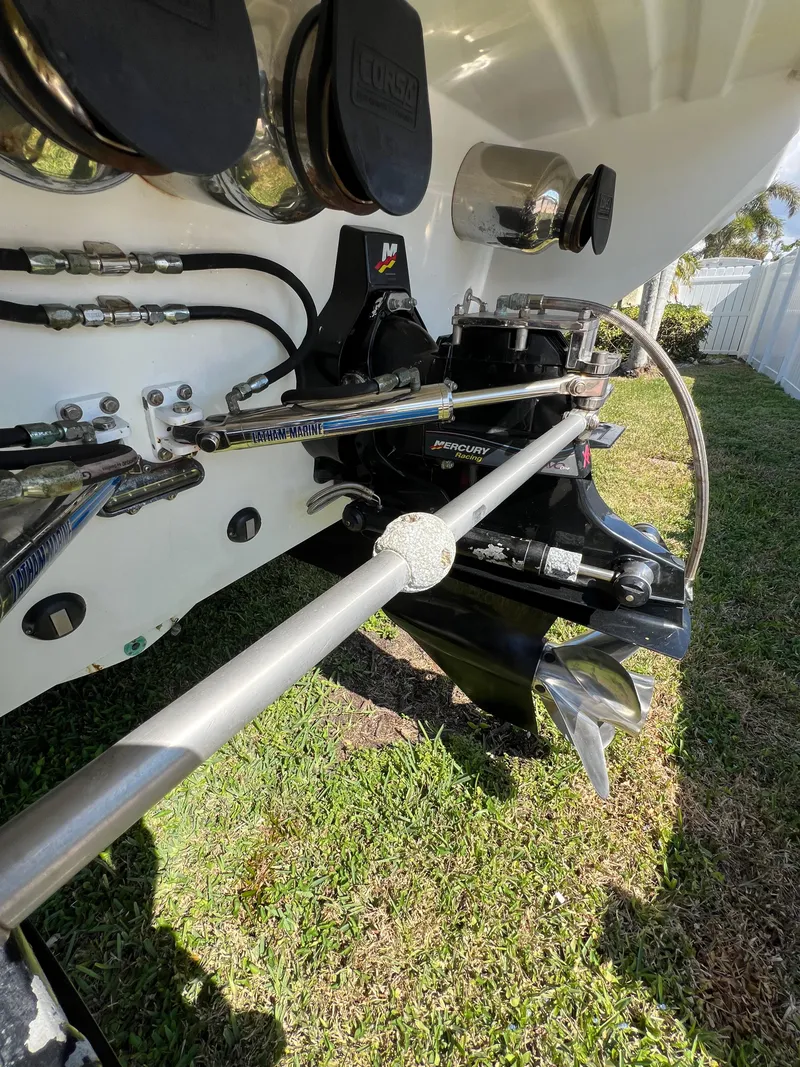 Slide: The Image of Close-up of 2016 Formula 353 FASTech boat's propulsion system and propeller on grass. - 15
