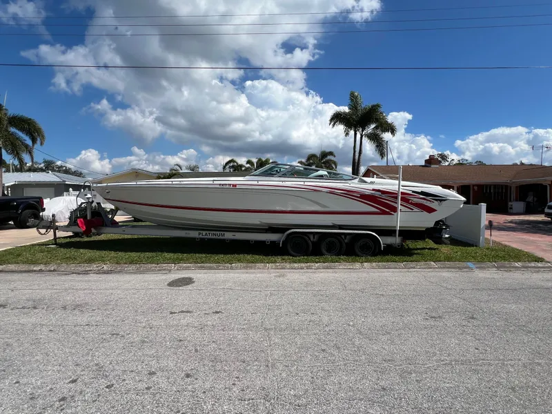 Slide: The Image of 2016 Formula 353 FASTech boat on trailer, parked in a residential area. - 2