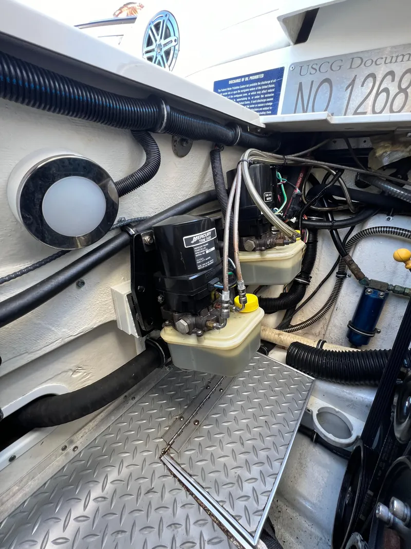 Slide: The Image of Engine compartment of a 2016 Formula 353 FASTech boat, showing mechanical components and wiring. - 32