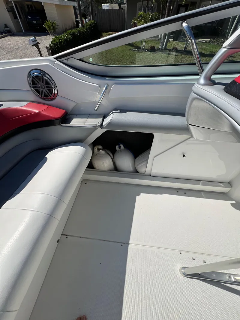 Slide: The Image of 2016 Formula 353 FASTech boat interior with white seating and storage compartment. - 39