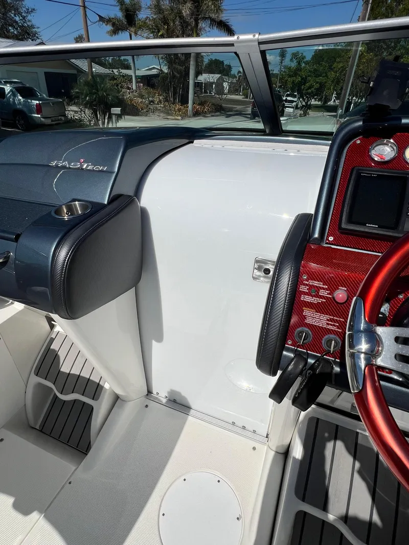 Slide: The Image of 2016 Formula 353 FASTech boat interior with sleek dashboard and steering wheel. - 40