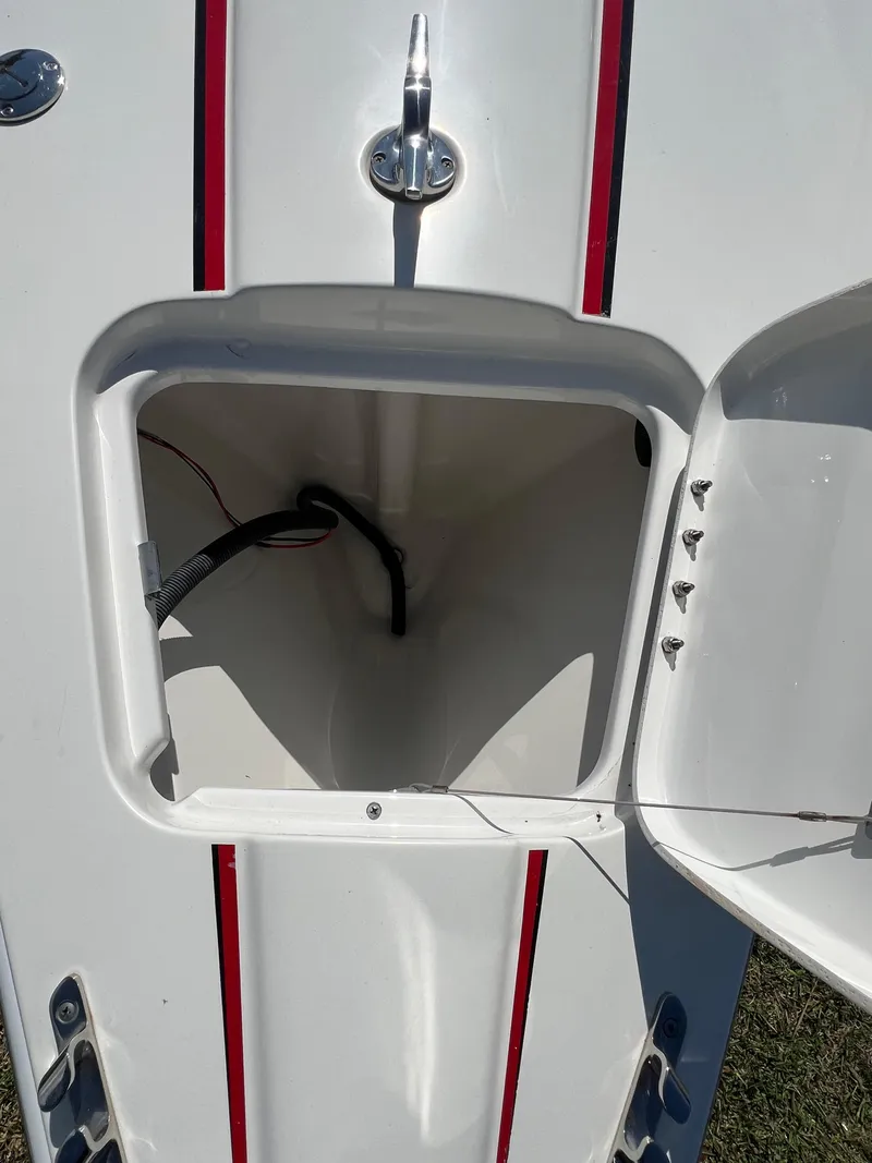 Slide: The Image of 2016 Formula 353 FASTech boat storage compartment with red stripes. - 7
