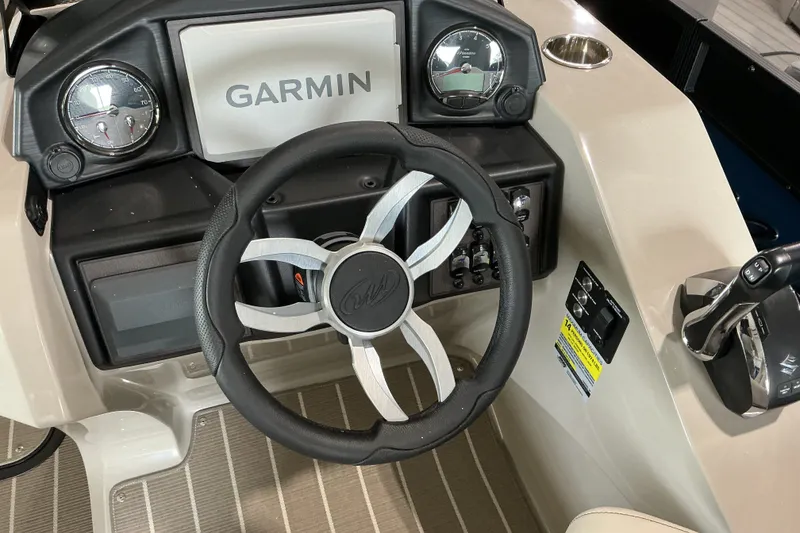 Slide: The Image of Steering console of 2026 Manitou 25 Encore RF SHP with Garmin display and controls. - 12