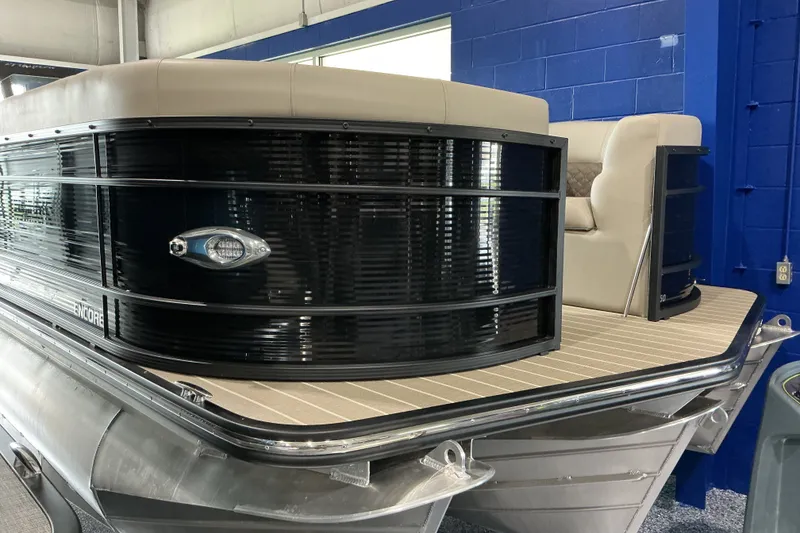 Slide: The Image of 2026 Manitou 25 Encore RF SHP pontoon boat with sleek design and comfortable seating. - 3