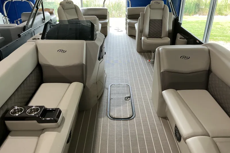 Slide: The Image of Interior of 2026 Manitou 25 Encore RF SHP pontoon boat with luxurious seating. - 10