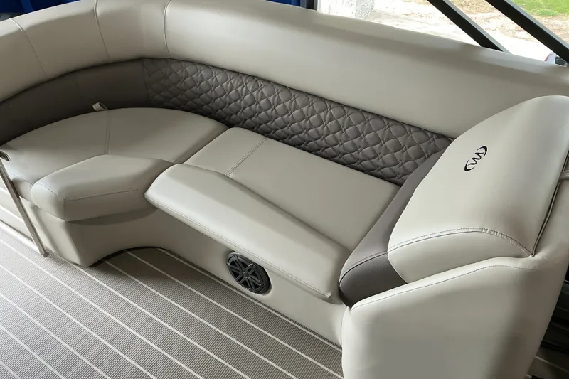 Slide: The Image of Luxurious seating in the 2026 Manitou 25 Encore RF SHP pontoon boat interior. - 5