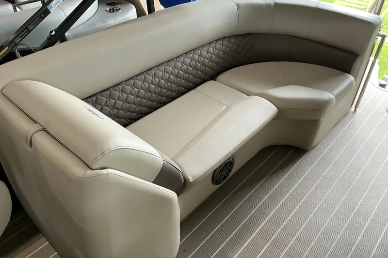 Slide: The Image of Luxurious seating on 2026 Manitou 25 Encore RF SHP pontoon boat, featuring elegant upholstery and design. - 6