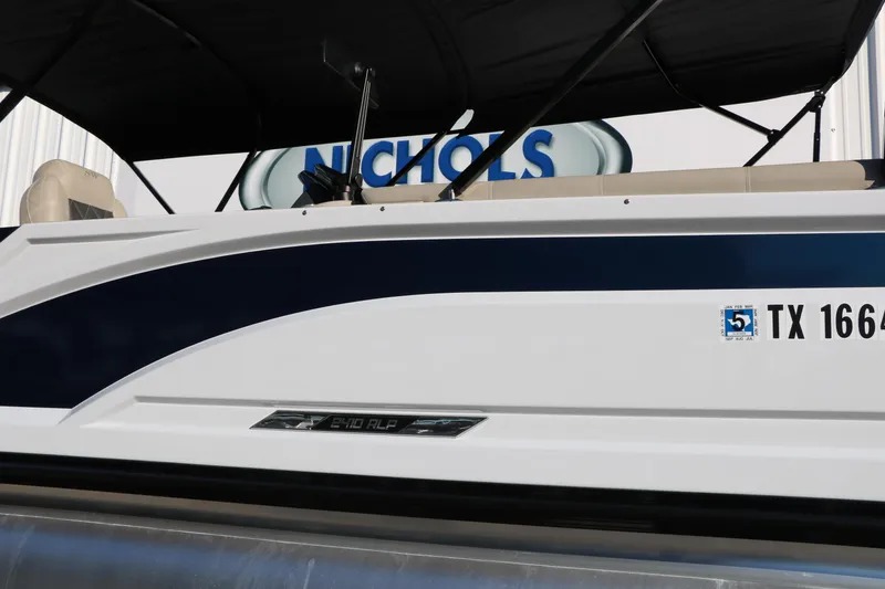 Slide: The Image of 2023 Silver Wave 2410 SW5 RLP boat with Texas registration, side view. - 16