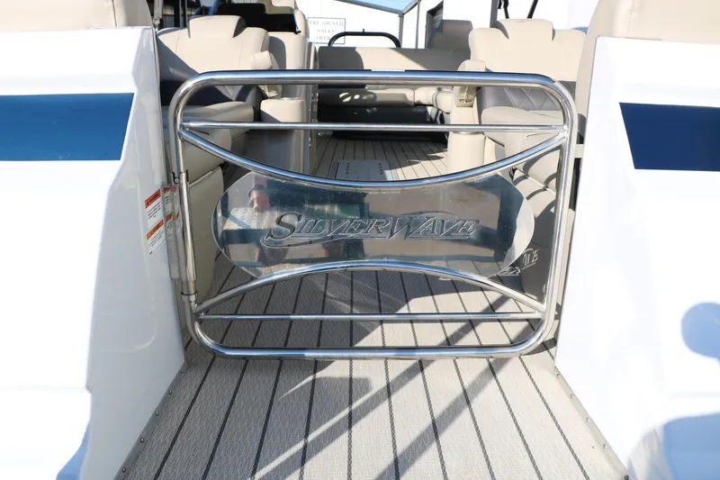 Slide: The Image of 2023 Silver Wave 2410 SW5 RLP boat interior with branded gate and seating. - 21